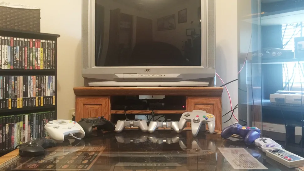A cluttered TV setup with multiple consoles connected